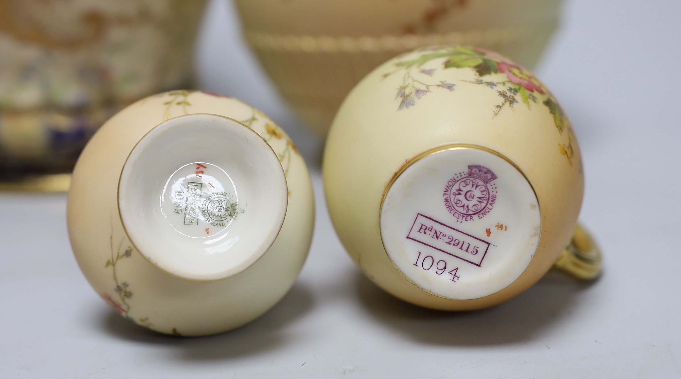 Three Royal Worcester blush vessels and a Carltonware biscuit barrel